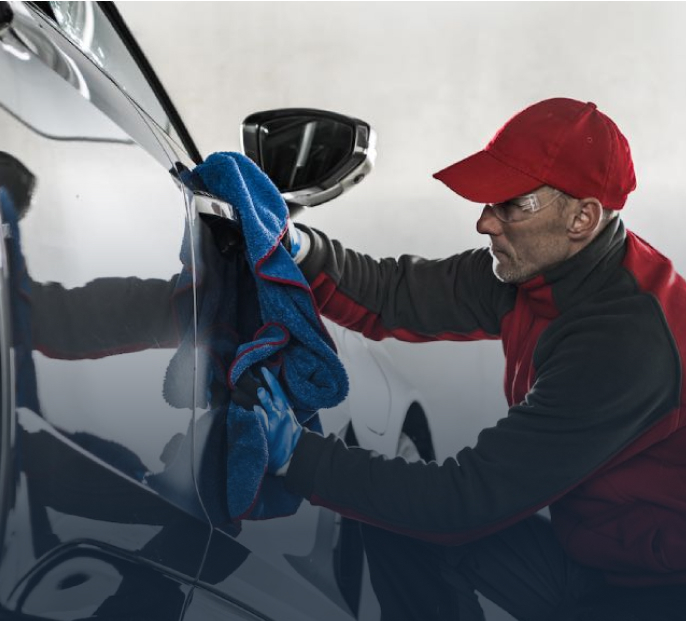 A red Lukoil racing car drifting on track with smoke effects showing dynamic motorsport action